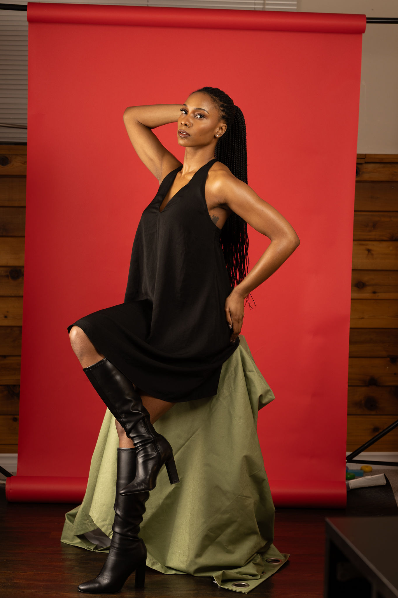 Studio portrait of Reena Jolly against a red background
